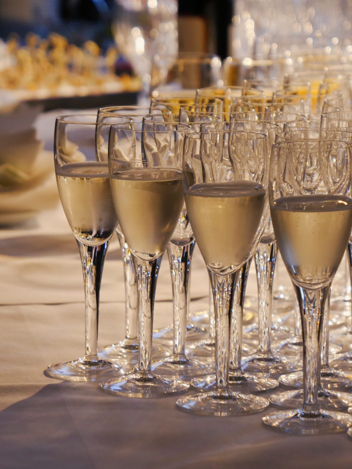 glasses of champagne on table event setting